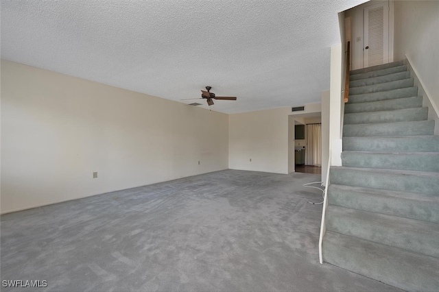 180 Cypress Way E Unit D124, Naples, FL 34110 - stairway with a ceiling fan, carpet flooring, and a textured ceiling