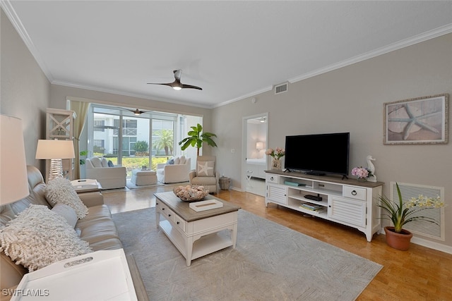 7058 Barrington Cir Unit 102, Naples, FL 34108 - living area featuring ornamental molding, baseboards, light wood finished floors, and ceiling fan
