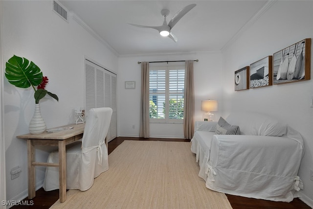 7058 Barrington Cir Unit 102, Naples, FL 34108 - bedroom with crown molding, wood finished floors, baseboards, and a ceiling fan