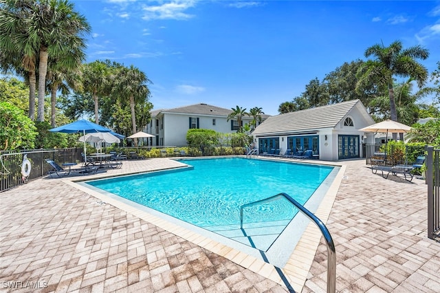 7058 Barrington Cir Unit 102, Naples, FL 34108 - community pool with a patio