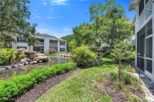 7058 Barrington Cir Unit 102, Naples, FL 34108 - view of yard featuring a water view