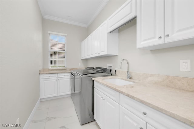 2722 Olde Cypress Dr, Naples, FL 34119 - laundry area featuring cabinet space, washing machine and dryer, light marble finish flooring, crown molding, and baseboards