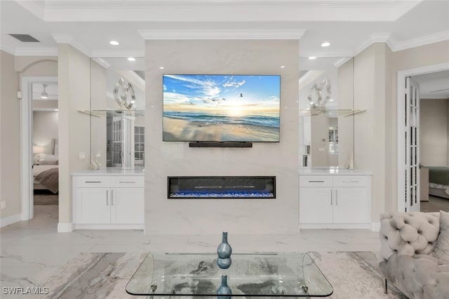 2722 Olde Cypress Dr, Naples, FL 34119 - living area featuring recessed lighting, crown molding, a fireplace, light marble finish flooring, and baseboards