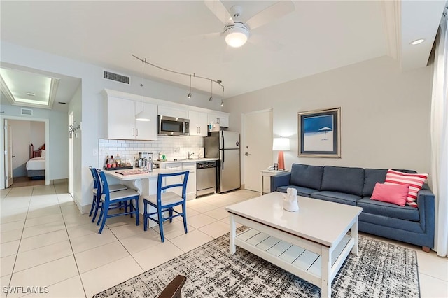 190 Estero Blvd Unit 303, Fort Myers Beach, FL 33931 - living area with a ceiling fan and light tile patterned floors