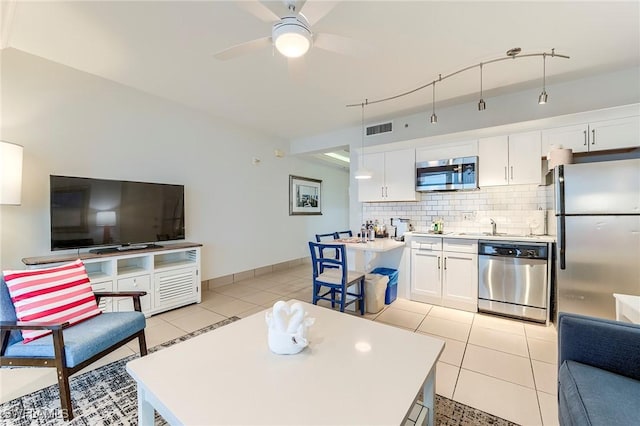 190 Estero Blvd Unit 303, Fort Myers Beach, FL 33931 - living room featuring ceiling fan and light tile patterned floors