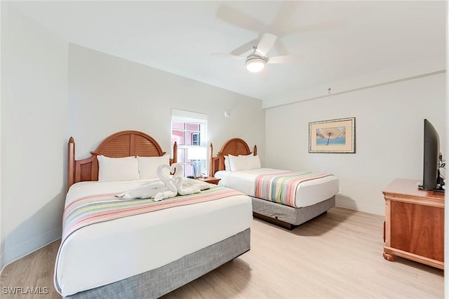 190 Estero Blvd Unit 303, Fort Myers Beach, FL 33931 - bedroom with light wood-style floors, baseboards, and ceiling fan