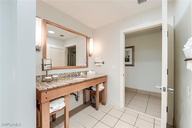 190 Estero Blvd Unit 303, Fort Myers Beach, FL 33931 - bathroom with a sink, tile patterned flooring, and baseboards