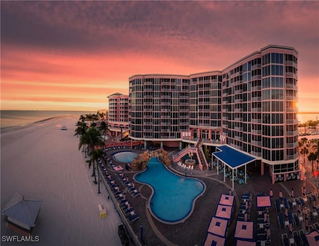 190 Estero Blvd Unit 303, Fort Myers Beach, FL 33931 - pool at dusk with a community pool and a water view
