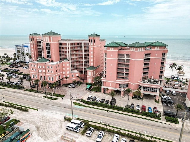 190 Estero Blvd Unit 303, Fort Myers Beach, FL 33931 - view of apartment building / complex with a water view and uncovered parking