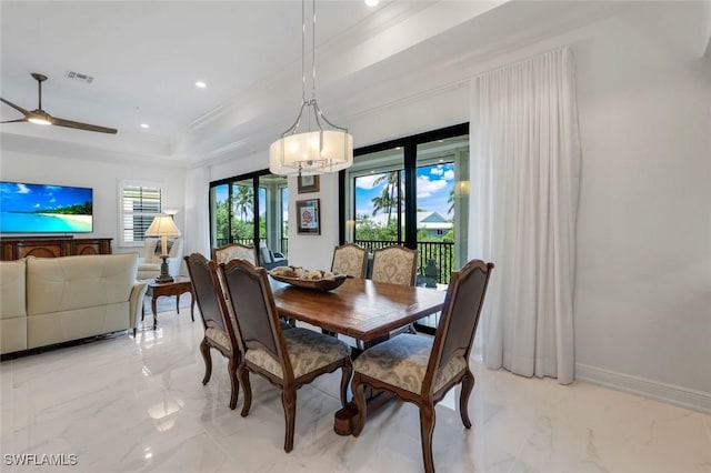 2488 Breakwater Way Unit 201, Naples, FL 34112 - dining room with light marble finish flooring, a tray ceiling, a chandelier, ornamental molding, and recessed lighting