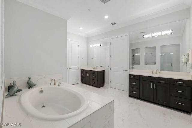 2488 Breakwater Way Unit 201, Naples, FL 34112 - bathroom featuring two vanities, a garden tub, a stall shower, marble finish floors, and ornamental molding