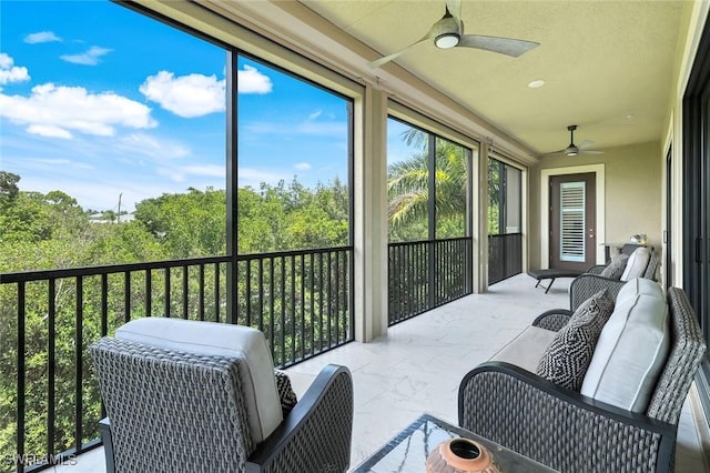2488 Breakwater Way Unit 201, Naples, FL 34112 - sunroom / solarium featuring a ceiling fan and outdoor lounge area