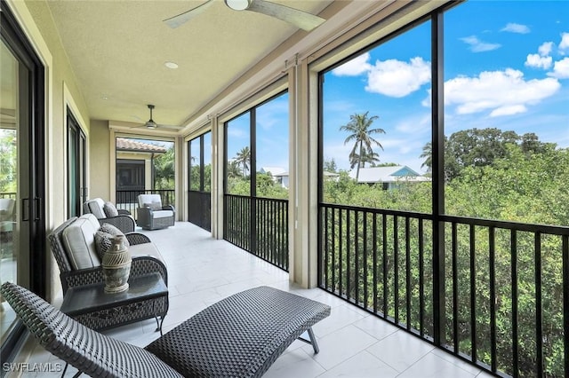 2488 Breakwater Way Unit 201, Naples, FL 34112 - sunroom featuring a ceiling fan and healthy amount of natural light