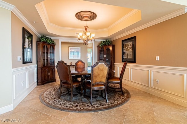 1050 Borghese Ln Unit 1101, Naples, FL 34114 - dining area with a chandelier, ornamental molding, a decorative wall, a tray ceiling, and light tile patterned flooring