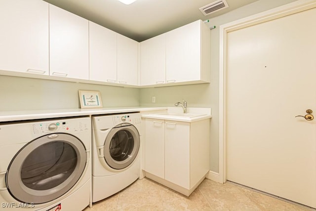 1050 Borghese Ln Unit 1101, Naples, FL 34114 - laundry area featuring washer and dryer, cabinet space, and light tile patterned flooring