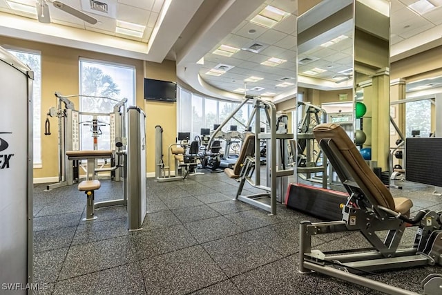 1050 Borghese Ln Unit 1101, Naples, FL 34114 - gym featuring healthy amount of natural light, a drop ceiling, and baseboards