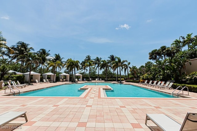 1050 Borghese Ln Unit 1101, Naples, FL 34114 - community pool featuring a patio area