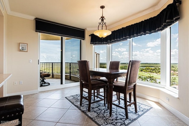 1050 Borghese Ln Unit 1101, Naples, FL 34114 - dining area with crown molding, healthy amount of natural light, light tile patterned floors, and baseboards