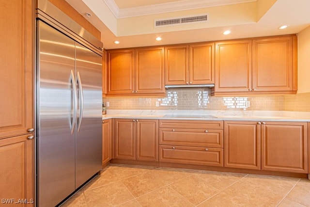 1050 Borghese Ln Unit 1101, Naples, FL 34114 - kitchen with stainless steel built in refrigerator, crown molding, decorative backsplash, light countertops, and black electric stovetop