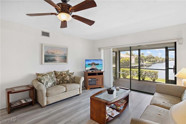 1010 SW 48th Ter Unit 102, Cape Coral, FL 33914 - living room featuring a ceiling fan and light wood-type flooring