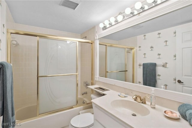 1010 SW 48th Ter Unit 102, Cape Coral, FL 33914 - bathroom featuring vanity, toilet, and enclosed tub / shower combo