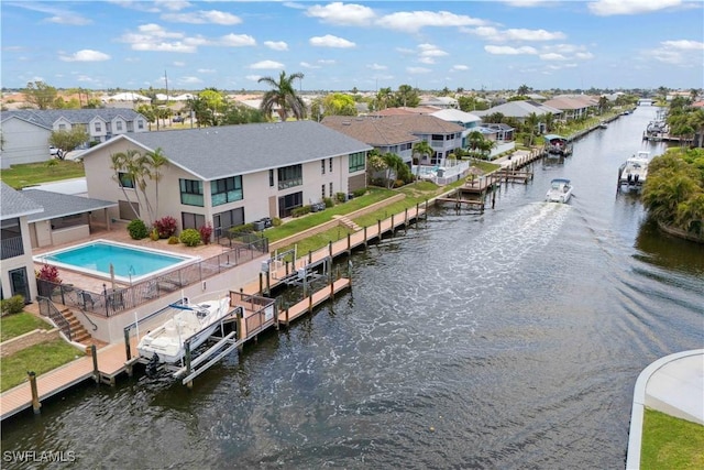 1010 SW 48th Ter Unit 102, Cape Coral, FL 33914 - back of house with a water view, a residential view, and stucco siding