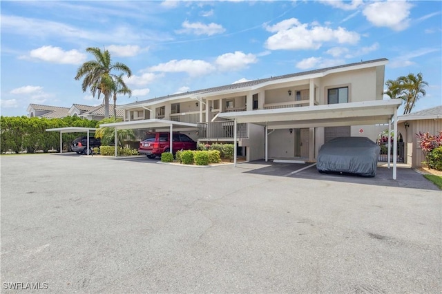 1010 SW 48th Ter Unit 102, Cape Coral, FL 33914 - view of property with covered parking