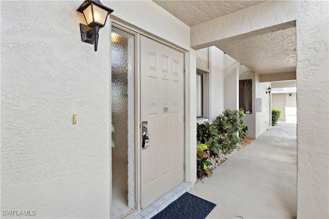 1010 SW 48th Ter Unit 102, Cape Coral, FL 33914 - view of exterior entry featuring stucco siding