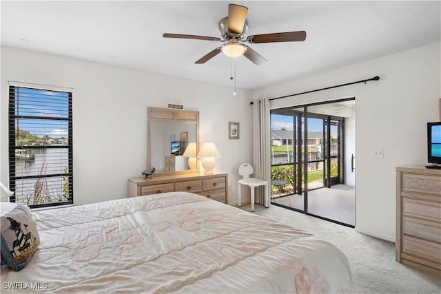 1010 SW 48th Ter Unit 102, Cape Coral, FL 33914 - bedroom with access to outside, light carpet, ceiling fan, and baseboards
