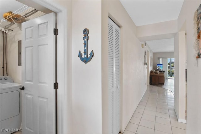 1010 SW 48th Ter Unit 102, Cape Coral, FL 33914 - corridor featuring washer / dryer, light tile patterned floors, baseboards, and electric panel