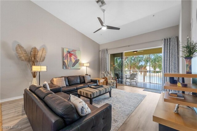 14769 Calusa Palms Dr Unit 203, Fort Myers, FL 33919 - living area featuring ceiling fan, light wood-type flooring, and high vaulted ceiling