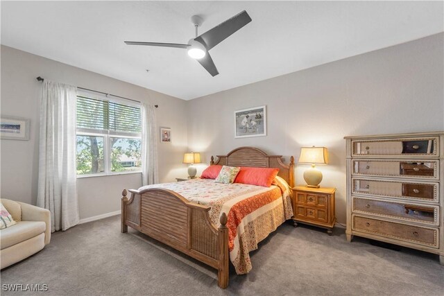 14769 Calusa Palms Dr Unit 203, Fort Myers, FL 33919 - bedroom with carpet flooring, baseboards, and a ceiling fan