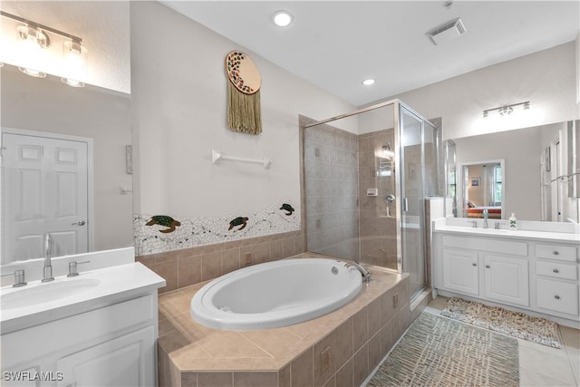 14769 Calusa Palms Dr Unit 203, Fort Myers, FL 33919 - bathroom with a stall shower, a garden tub, two vanities, tile patterned flooring, and recessed lighting