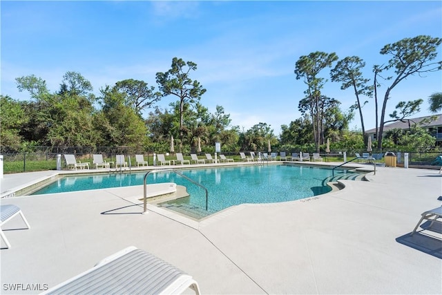 14769 Calusa Palms Dr Unit 203, Fort Myers, FL 33919 - community pool featuring a patio