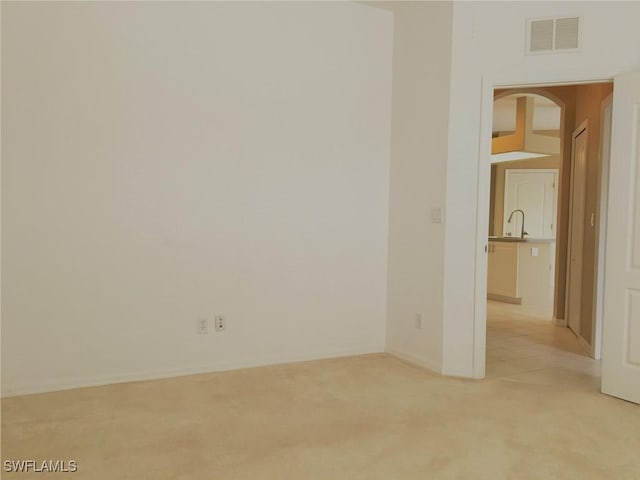 1820 SW 29th Ter, Cape Coral, FL 33914 - unfurnished room with light colored carpet and a sink
