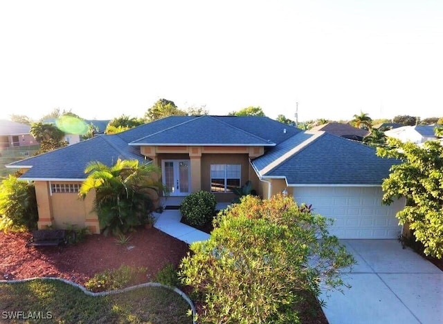 1820 SW 29th Ter, Cape Coral, FL 33914 - ranch-style house featuring a garage, french doors, driveway, and roof with shingles