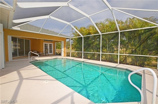1820 SW 29th Ter, Cape Coral, FL 33914 - outdoor pool with french doors, a patio area, and a lanai