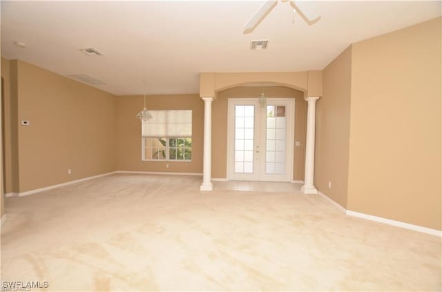 1820 SW 29th Ter, Cape Coral, FL 33914 - unfurnished room featuring ornate columns, arched walkways, light colored carpet, ceiling fan, and baseboards
