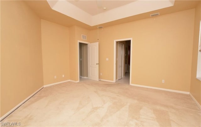 1820 SW 29th Ter, Cape Coral, FL 33914 - empty room featuring light carpet, baseboards, and a towering ceiling
