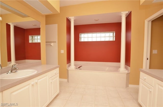 1820 SW 29th Ter, Cape Coral, FL 33914 - full bath featuring vanity, a garden tub, ornate columns, and baseboards