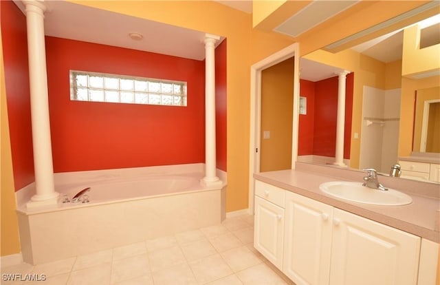 1820 SW 29th Ter, Cape Coral, FL 33914 - bathroom featuring a garden tub, vanity, and decorative columns