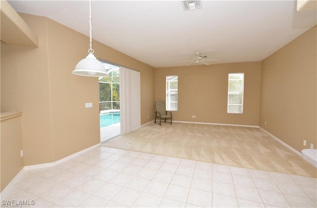 1820 SW 29th Ter, Cape Coral, FL 33914 - spare room with plenty of natural light, light carpet, a ceiling fan, and baseboards