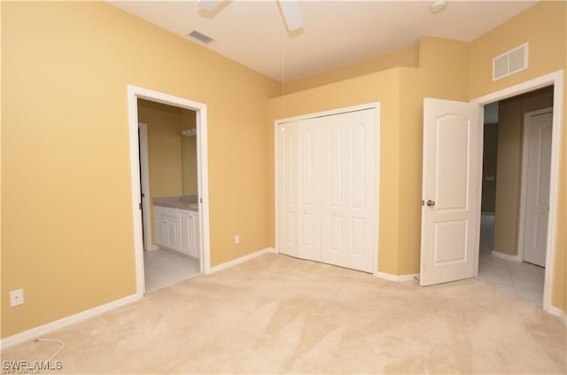 1820 SW 29th Ter, Cape Coral, FL 33914 - unfurnished bedroom with light colored carpet, a closet, and baseboards