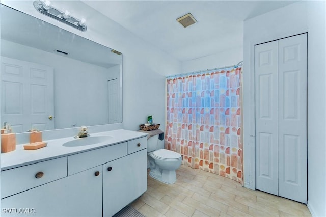 911 Medford Ave S, Lehigh Acres, FL 33974 - full bathroom with a closet, vanity, and toilet
