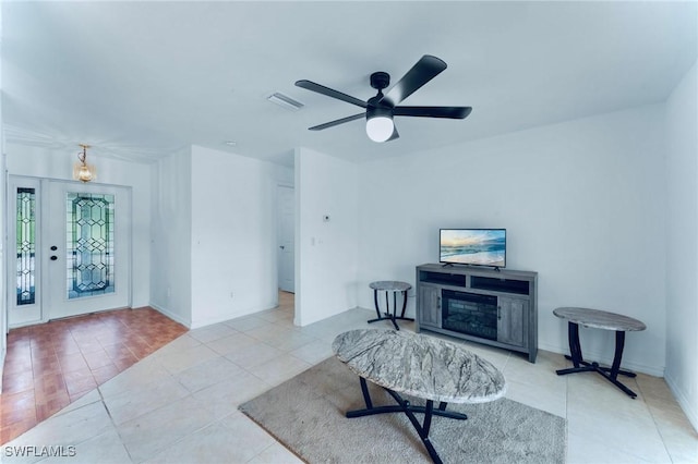 911 Medford Ave S, Lehigh Acres, FL 33974 - living area featuring tile patterned flooring and ceiling fan