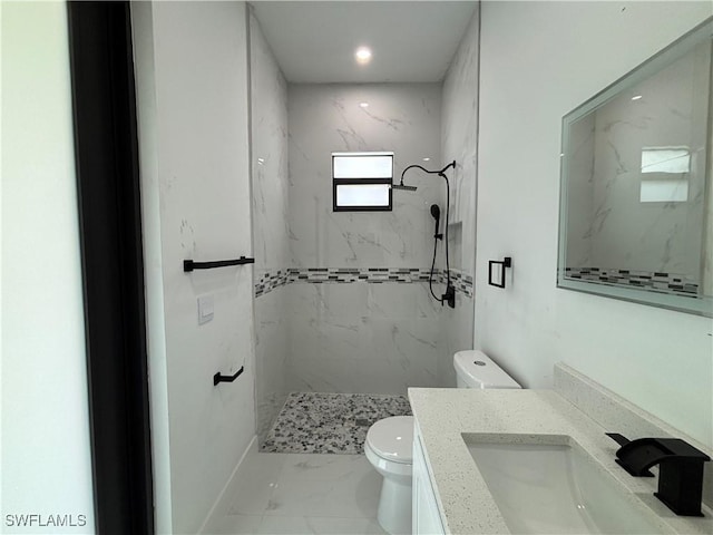 full bathroom featuring marble look tiles, vanity, a marble finish shower, and recessed lighting