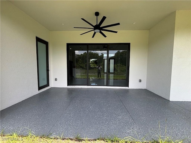 view of patio featuring a ceiling fan