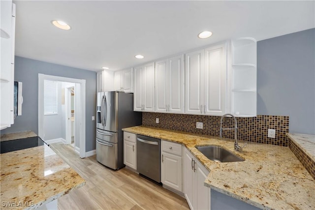 5831 Cove Cir Unit 6, Naples, FL 34119 - kitchen with stainless steel appliances, a sink, white cabinets, open shelves, and recessed lighting