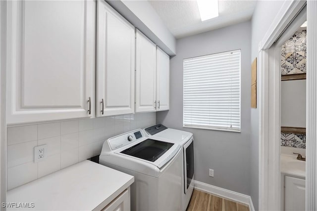 5831 Cove Cir Unit 6, Naples, FL 34119 - laundry room with cabinet space, washing machine and clothes dryer, wood finished floors, and baseboards