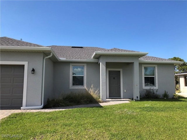 1530 NW 25th Ave, Cape Coral, FL 33993 - property entrance with stucco siding, roof with shingles, a yard, and a garage